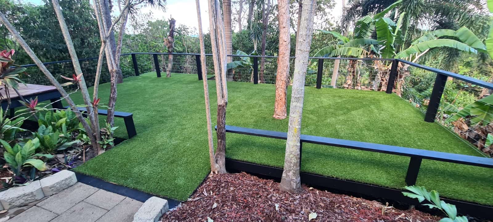 synthetic grass around trees